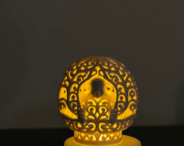 Ornamental Buddha sphere for an LED tealight